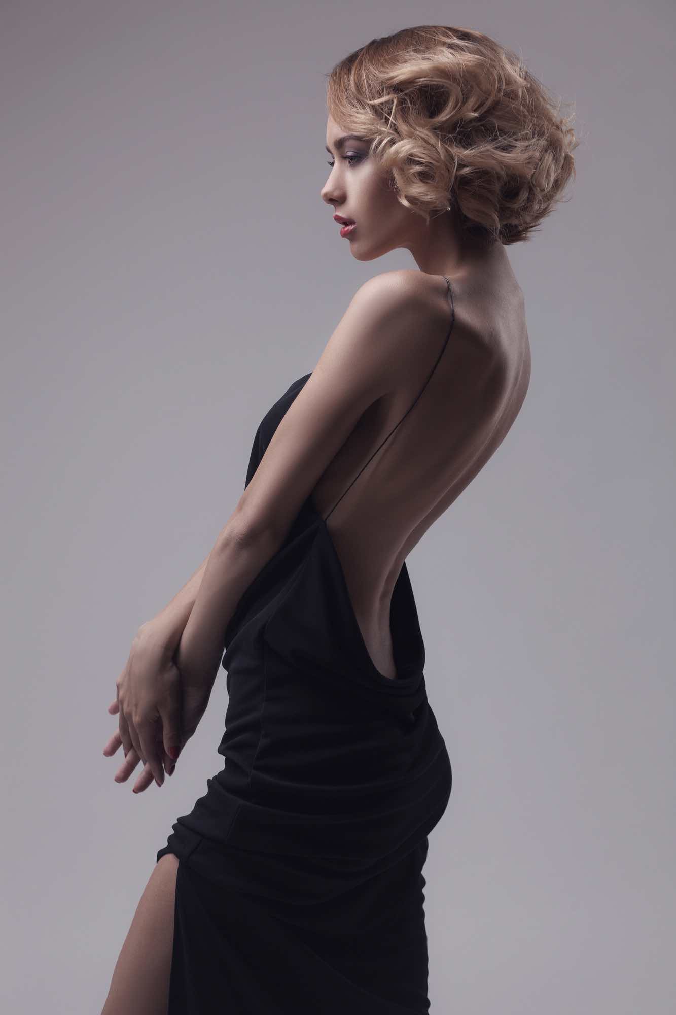 beautiful woman model posing in elegant dress