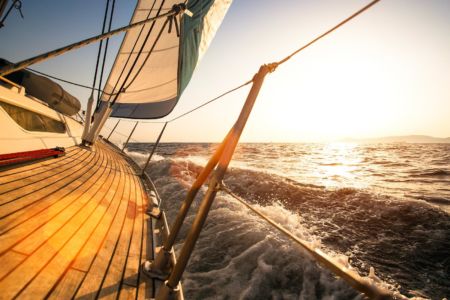 Sailing regatta, during sunset.