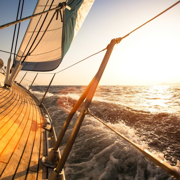 Sailing regatta, during sunset.