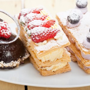 Selection Of Fresh Cream Cake Dessert Plate Selection of fresh cream napoleon and chocolate mousse cake